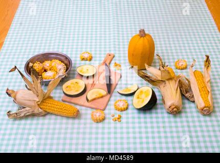 Still life of corn on the cob with two varieties of squash Stock Photo