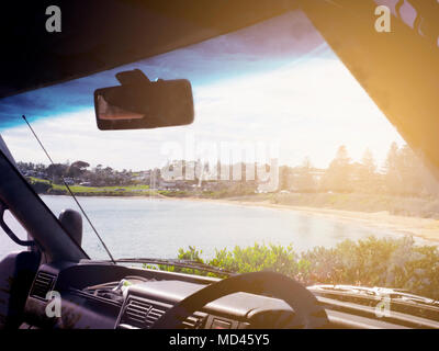 View of Bermagui, seen through windscreen of car, New South Wales, Australia Stock Photo