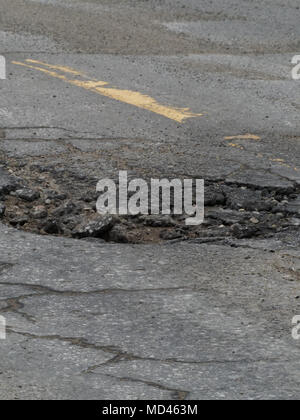 Quebec, Canada. Large pothole in asphalt road Stock Photo