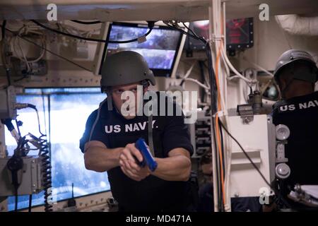 180316-N-GR168-0065 MEDITERRANEAN SEA (March 16, 2018) Quartermaster 3rd Class Gregory Morgan, from Denver, searches for a simulated bomb during an antiterrorism force protection exercise aboard the San Antonio-class amphibious transport dock ship USS New York (LPD 21). New York, homeported in Mayport, Florida, is conducting naval operations in the U.S. 6th Fleet area of operations. (U.S. Navy photo by Mass Communication Specialist 2nd Class Lyle Wilkie/Released) Stock Photo
