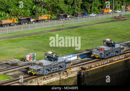 TrainThese mules are used for the tight locks of ships in Panama Stock Photo