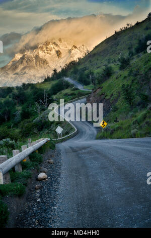 Paine Massif mountains  and road at sunrise . Torres del Paine National Park, Chile, Patagonia Stock Photo