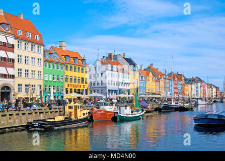 COPENHAGEN, DENMARK - APRIL 13, 2010: Colorful facades along Nyhavn. Nyhavn is a 17th-century waterfront, canal and entertainment district Stock Photo