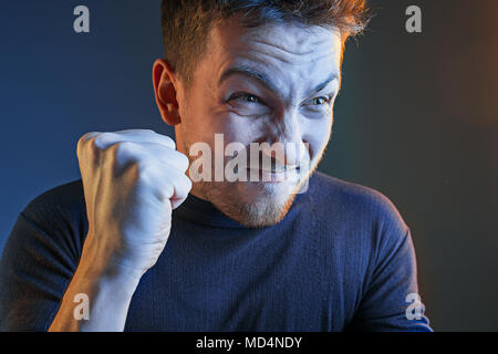 Sports, emotions and fan people concept - sad man watching sports on tv and supporting team at home Stock Photo