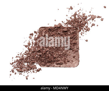 Crushed texture of brown eye shadow isolated on white background. Texture of broken golden powder on white background Stock Photo