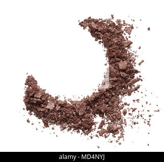 Crushed texture of brown eye shadow isolated on white background. Texture of broken golden powder on white background Stock Photo