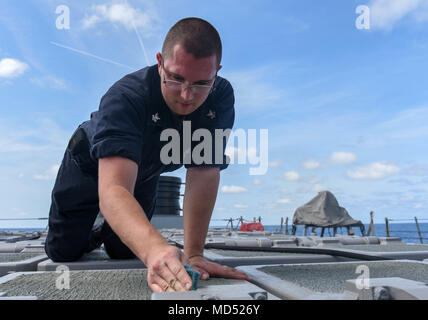 180316-N-ET513-106 MEDITERRANEAN SEA (March 16, 2018) Gunners Mate 2nd Class Bradley Farley cleans the vertical launching systems on the Arleigh Burke-class guided-missile destroyer USS Laboon (DDG 58), March 16, 2018. Laboon, home-ported at Naval Station Norfolk, is in the U.S. 6th Fleet area of operations in support of regional allies and partners and U.S. national security interests in Europe and Africa. (U.S. Navy photo by Mass Communication Specialist 3rd Class Kallysta Castillo) Stock Photo