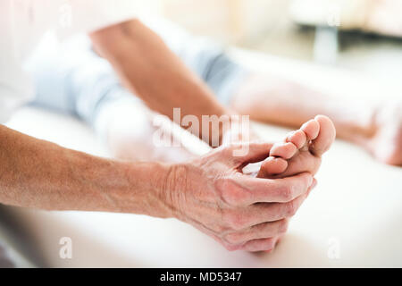 A physiotherapist working with a patient. Stock Photo