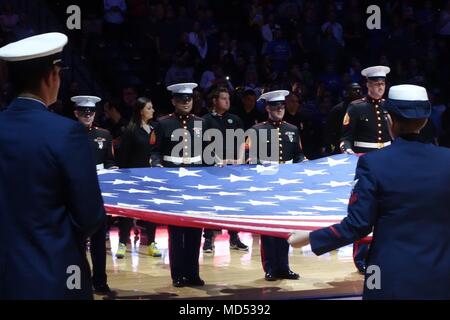 Service members from all military branches participate in a pre-game ceremony at the Denver Nuggets Military Appreciation Game in the Denver Pepsi Center, March 11, 2018. Kroenke Sports & Entertainment hosted a Military Appreciation Weekend from March 10-11, which included the Denver Nuggets basketball game, Colorado Avalanche hockey game, and the Colorado Mammoth box lacrosse game. Stock Photo