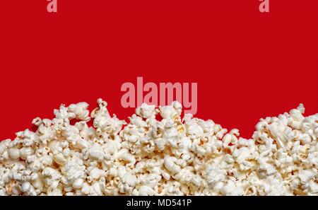 Popcorn viewed from above on red background with copy space. Stock Photo