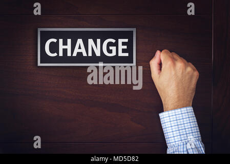 Changes in business, conceptual image of male business person knocking on the door Stock Photo