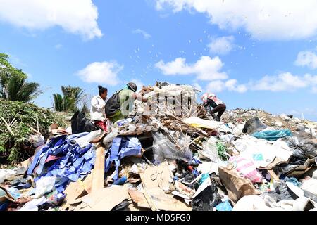 180321-N-VK873-0529 PUERTO CORTES, Honduras (March 21, 2018) Honduran locals search through a garbage pile at the city's landfill during Continuing Promise 2018. U.S. Naval Forces Southern Command/U.S. 4th Fleet has deployed a force to execute Continuing Promise to conduct civil-military operations including humanitarian assistance, training engagements, and medical, dental, and veterinary support in an effort to show U.S. support and commitment to Central and South America. (U.S. Navy photo by Mass Communication Specialist 2nd Class Kayla Cosby/ Released) Stock Photo
