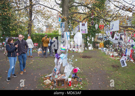 Visitors at an impromptu shrine or memorial to the pop star George Michael opposite the deceased musician’s house in Highgate, north London in 2017 Stock Photo