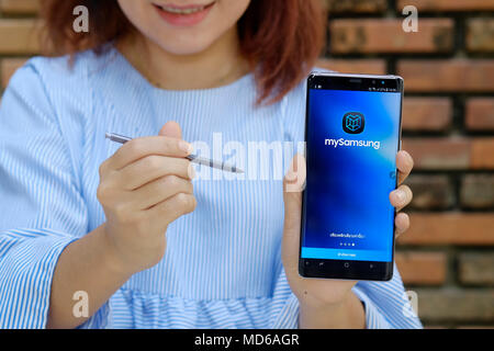 CHIANG MAI,THAILAND - FEB 22,2018 :New Samsung galaxy Note 8 on woman hands and smile on the face,Samsung note  8 is a new gadget with new mobile of S Stock Photo