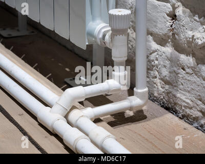 Connecting the bimetal radiator to the heating system Stock Photo