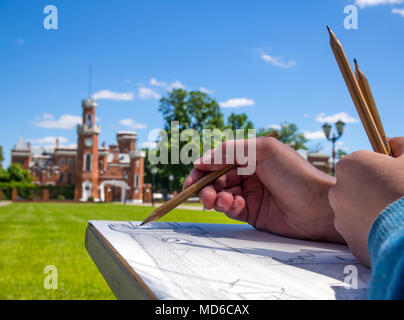 Ramon, Russia - June 07, 2017: The artist draws the palace of Princess Oldenburg in an open air in the village of Ramon, Voronezh region Stock Photo