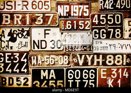 Retro License Plates on the wall in grunge style. Stock Photo