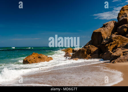 Sea waves crashing against the rocks Stock Photo