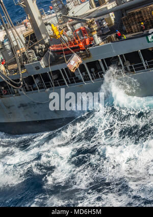 180324-N-NJ910-0104 MEDITERRANEAN SEA (March 24, 2018) The Kaiser-class fleet replenishment oiler USNS Patuxent (T-AO 201) sends a pallet of supplies to the Wasp-class amphibious assault ship USS Iwo Jima (LHD 7)  during a replenishment-at-sea March 24, 2018. Iwo Jima, homeported in Mayport, Florida, is conducting naval operations in the U.S. 6th Fleet area of operations. (U.S. Navy photo by Mass Communication Specialist Seaman Dary M. Patten/Released) Stock Photo