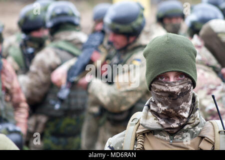 Yavoriv, Ukraine – A Ukrainian Soldier assigned to 3rd Battalion, 14th Mechanized Brigade, poses for a photo while preparing for a battalion field training exercise at the Yavoriv Combat Training Center here Mar. 15. Currently more than 220 New York National Guard Soldiers are assigned to the CTC where they are mentoring Ukrainian Army Soldiers as they strive toward obtaining NATO interoperability. (U.S. Army photo by Sgt. Alexander Rector) Stock Photo