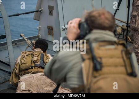 180331-N-YJ378-0078 PACIFIC OCEAN (March 31, 2018) Marine snipers assigned to the Maritime Raid Force Reconnaissance Detachment stand watch during a force protection exercise aboard San Antonio-class amphibious transport dock USS Anchorage (LPD 23), during an amphibious squadron and 13th Marine Expeditionary Unit (MEU) integration (PMINT) exercise. PMINT is a training evolution between Essex Amphibious Ready Group and 13th MEU, which allows Sailors and Marines to train as a cohesive unit in preparation for their upcoming deployment. (U.S. Navy photo by Mass Communication Specialist 2nd Class B Stock Photo