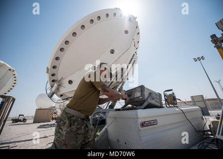 Silent Sentry is a United States Air Force system that protects satellite communications through electronic warfare capabilities. The archival image records diagnostic testing using a spectrum analyzer on satellite communication equipment at Al Udeid Air Base, Qatar, on March 30, 2018, supporting operational network integrity. Stock Photo