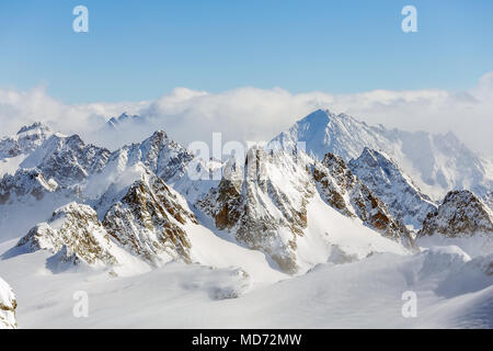 Wintertime view from Mt. Titlis in Switzerland. The Titlis is a mountain, located on the border between the Swiss cantons of Obwalden and Bern, it is  Stock Photo