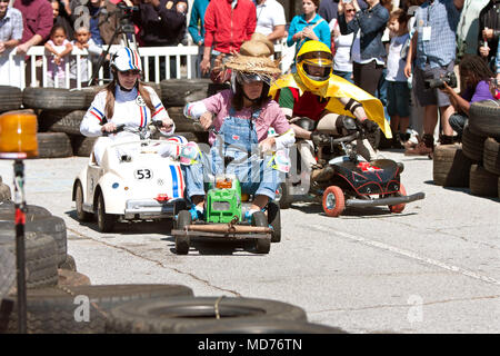 Young adults race miniature motorized vehicles they crafted in the power racing series at the annual Maker Faire on October 4, 2014 in Decatur, GA. Stock Photo