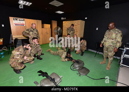 Sgt. Kavin Njah assigned U.S. Army Africa (center) and Sgt. Maj. David W. Myers U.S. Army Africa (right), show M4 carbine  at Italian Army Paratroopers assigned to Regiment “Savoia Cavalleria” Folgore Brigade Grosseto and Italian Soldiers of the 85th Reggimento Addestramento Volontari  “Verona” RAV,  conduct training using Engagement Skills Trainer (EST) at Caserma Ederle Vicenza, Italy, March 27, 2018. Italian Paratroopers use U.S. Army RTSD South equipment to enhance bilateral relations and to expand levels of cooperation and the capacity of the personnel involved in joint operations. (U.S. 