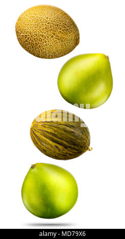 Falling cantaloupe golden melons and pomeloes isolated on white background with clipping path Stock Photo