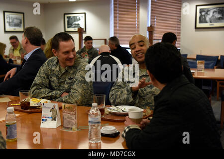 Civic leaders from MacDill Air Force Base, Fla. have lunch with Col. Ethan Griffin, 436th Airlift Wing commander, and other Airmen from various squadrons at the Patterson Dining Facility at Dover AFB, Del. March 28, 2018. The civic leaders had a chance to talk to some of Team Dover’s Airmen and find out what part of the mission they support. (U.S. Air Force Photo by Airman 1st Class Zoe M. Wockenfuss) Stock Photo