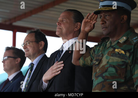 Daniel L. Foote, U.S. Ambassador to the Republic of Zambia, stands while the Zambian Army Band plays the American National Anthem during the closing ceremonies of ZAMBAT IV, Nanking Peace Mission Training Center, Lusaka, Zambia, March 29, 2018.Training modules included: marksmanship, mounted battle drills, training alongside Indian Army counterparts for battlefield trauma, cordon and search, and convoy operations with British soldiers. Zambian Infantry soldiers rehearsed tactics and real-world scenarios likely to be encountered while serving in support of the United Nations Multidimensional St Stock Photo