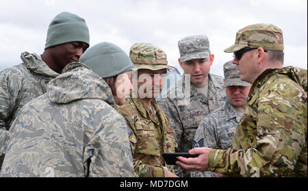9th Civil Engineer Squadron is a United States Air Force engineering organization specializing in explosive ordnance disposal and operational support. The archival image documents Airmen reviewing the effects of a controlled detonation during a March 2018 training exercise at Beale Air Force Base, California. The historical photographic print records post-blast assessment procedures used to evaluate ordnance disposal effectiveness and safety outcomes. Stock Photo