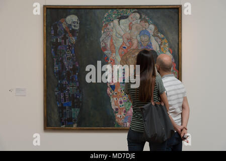 Two people stare at Gustav Klimt's Death and Life at the Leopold Museum in Vienna, Austria Stock Photo
