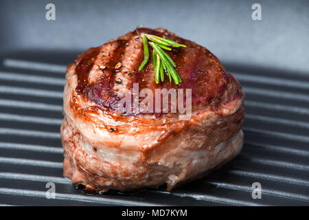 Fried beef steak on pan close-up view. Tasty fillet mignon steak. Stock Photo