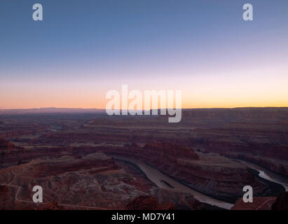 A sunset view from Deadhorse Point State Park  and overlooking Canyonlands National Park, near Moab, Utah, USA. Stock Photo