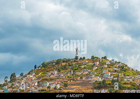 The Panecillo Hill with the Virgin of Quito with traditional colourful housing in the historic city center of Quito, Ecuador, South America. Stock Photo