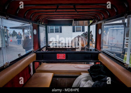 Pennsylvania, USA, APRIL, 18, 2018: Indoor view of the Amish buggy with a horse parked in a store Stock Photo