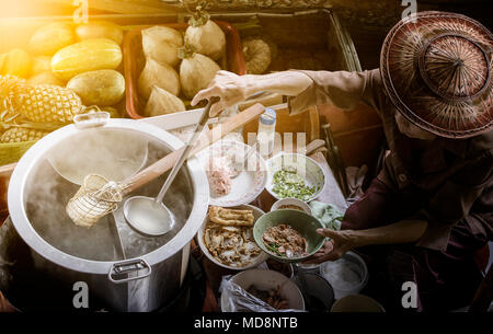 thai noodle food making on floating boat in floating market thailand Stock Photo