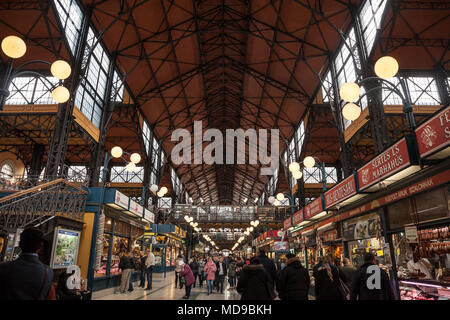 BUDAPEST, HUNGARY - APRIL 7, 2018: Interior of Budapest Great Market Hall (Nagy Vasarcsarnok) with a crowd in front. it is the biggest market hall of  Stock Photo