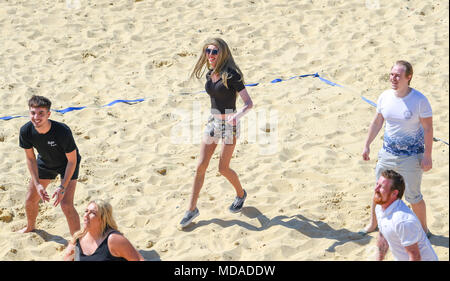 Brighton UK 19th April 2018  - Stars and extras from the reality television show 'The Only Way is Essex' enjoy  beach volleyball on Brighton seafront in the beautiful sunny weather during filming . The hot sunny weather is set to continue throughout Britain with temperatures expected to reach into the high twenties in parts of the South East Credit: Simon Dack/Alamy Live News Credit: Simon Dack/Alamy Live News Stock Photo