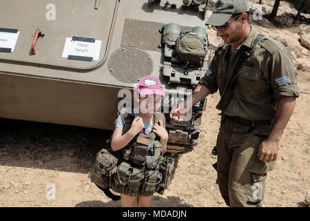 Maale Adumim, Israel. 19th April, 2018. Israeli families experience military weapons and equipment during celebrations marking Israel's 70th Independence Day at an IDF exhibition near Maale Adumim. Credit: Nir Alon/Alamy Live News Stock Photo