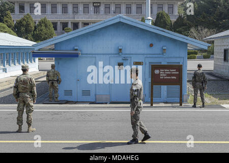 Paju, Gyeonggi, South Korea. 18th Apr, 2018. A Joint Security Area UNC soldiers stand guard before the military demarcation line during a press tour to the border truce village of Panmunjom in the Demilitarized Zone (DMZ) dividing the two Koreas. North Korean leader Kim Jong Un and South Korean President Moon Jae-in are due to meet on April 27 at the South's side of the demilitarized zone for the landmark inter-Korean summit. Credit: Ryu Seung-Il/ZUMA Wire/Alamy Live News Stock Photo