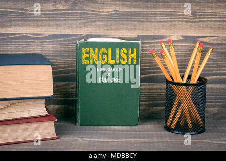 English language and culture concept. Book on a wooden background Stock Photo