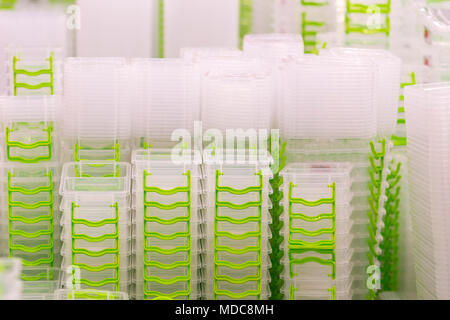 Stack of white food containers in kitchenware store. Stock Photo
