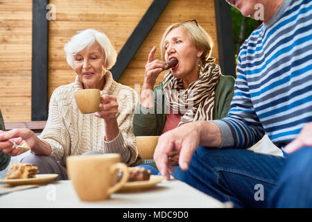 Senior Friends at Lunch Outdoors Stock Photo
