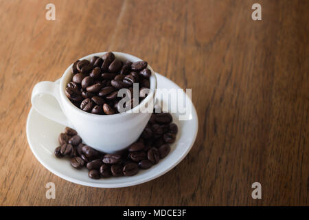 Coffee Cup or Coffee Beans on wooden table, stock photo Stock Photo