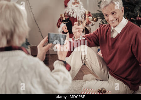 Handsome pensioner making funny faces Stock Photo