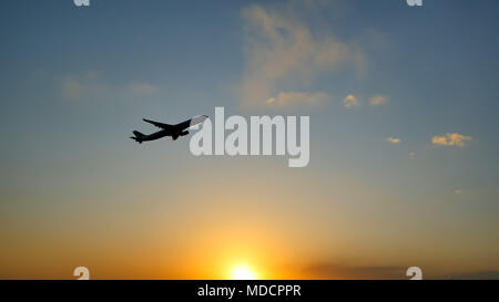 Plane taking off sky sunset sun dusk in airport China. Beijing. Stock Photo