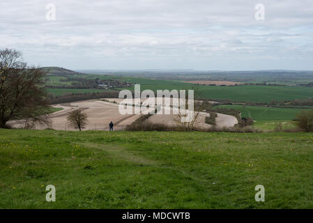 Lone man admiring the view from a hilltop on Dunstable Downs, Hertfordshire Stock Photo